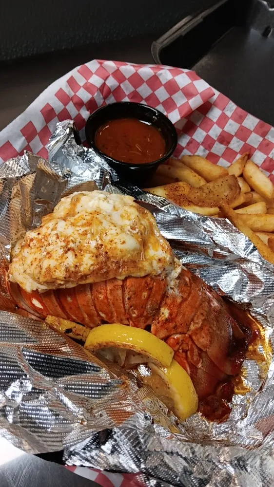 Grilled Lobster Tale with Side of Seasoned French Fries